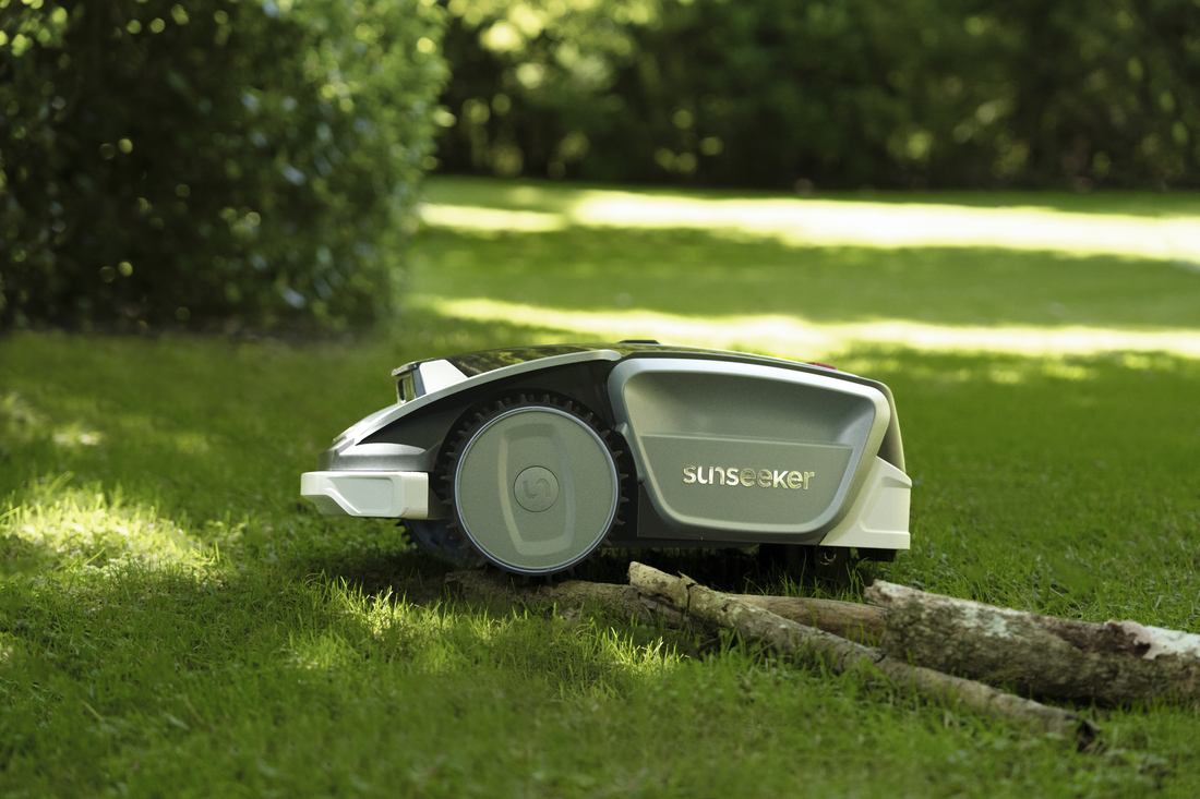 Robotic Lawn Mower on Green Grass